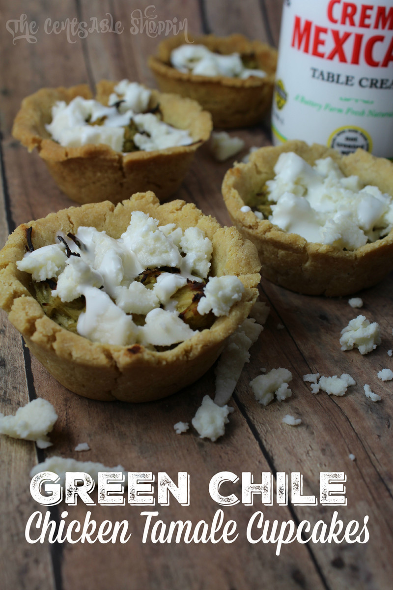 A wonderful Green Chile & Chicken Tamale Cupcake made with hatch green chiles and shredded chicken in a tamale-like cup, dressed with fresh cream and cheese.