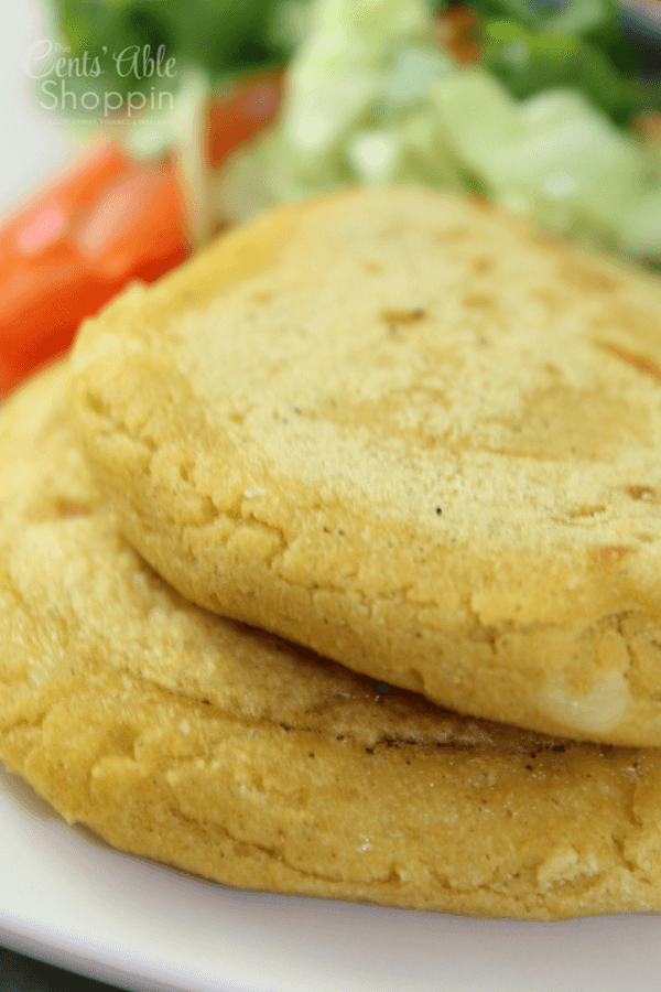 A pupusa is a traditional Salvadoran dish made of a thick, handmade corn tortilla, stuffed with cheese, and/or beans and cheese.
