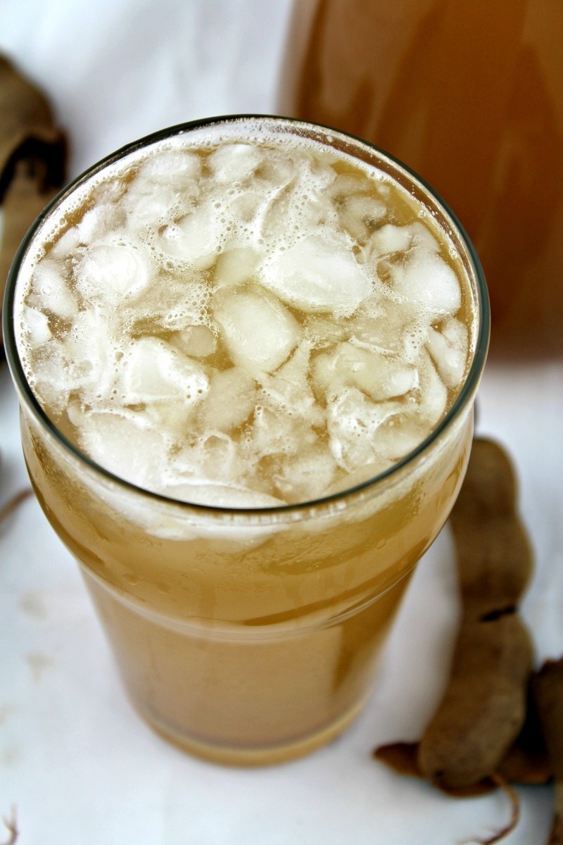 Agua de Tamarindo or, Tamarind Water, is one of the most popular aguas frescas in all of Mexico. Learn how to make Agua de Tamarindo easily at home.