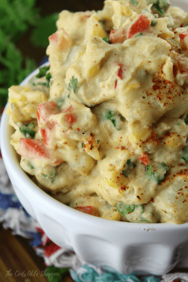 A delicious combination of Mexican spices, mayonnaise and fresh veggies coat potatoes for a twist on traditional potato salad.