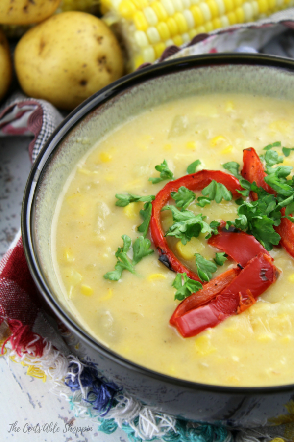 This rich and creamy corn chowder is filled with warm spices like paprika and cayenne pepper, combined with potatoes and topped with roasted peppers. It's the perfect soup for summer!