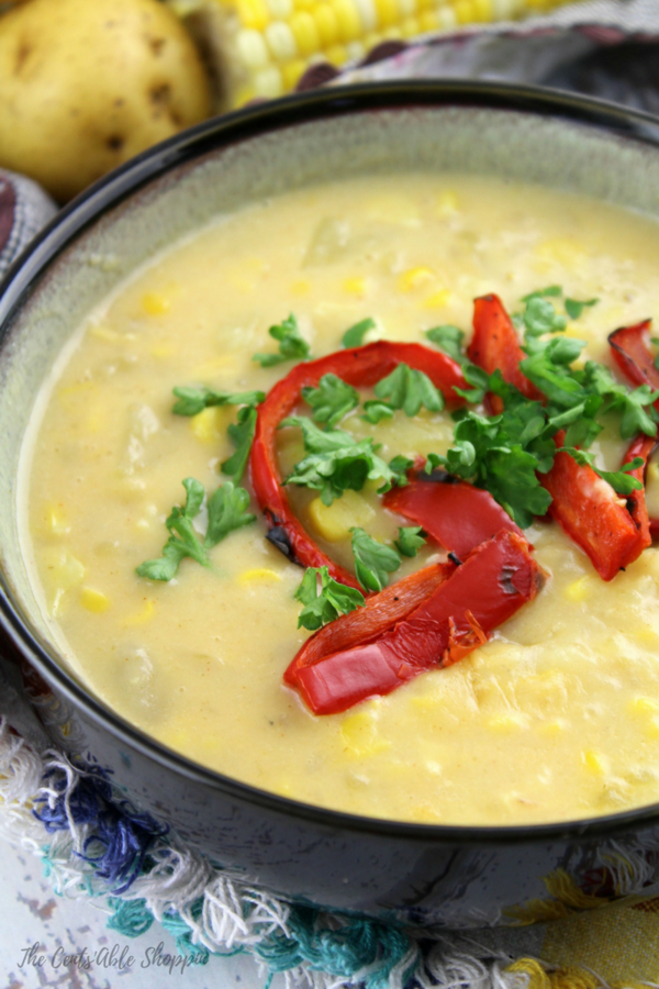 This rich and creamy corn chowder is filled with warm spices like paprika and cayenne pepper, combined with potatoes and topped with roasted peppers. It's the perfect soup for summer!