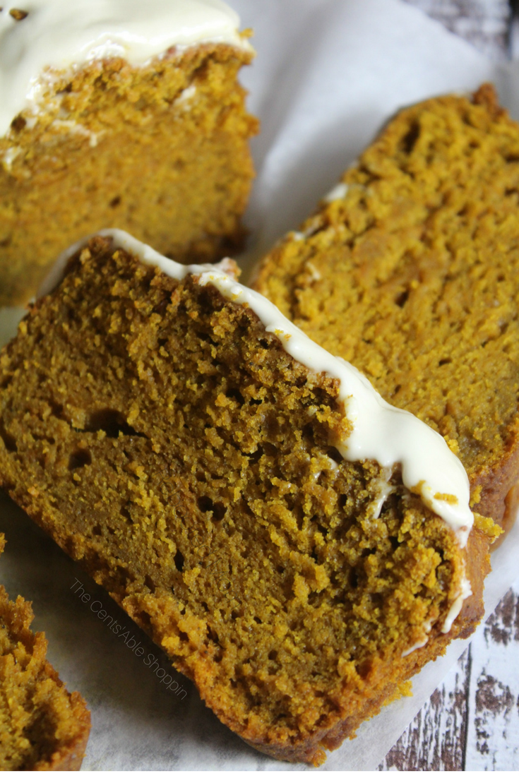 A moist and delicious pumpkin gingerbread, rich in fall spices and topped with a delectable maple-vanilla icing. This bread is a wonderful reason to cozy up by the fire and celebrate the season! #fall #gingerbread #pumpkin 