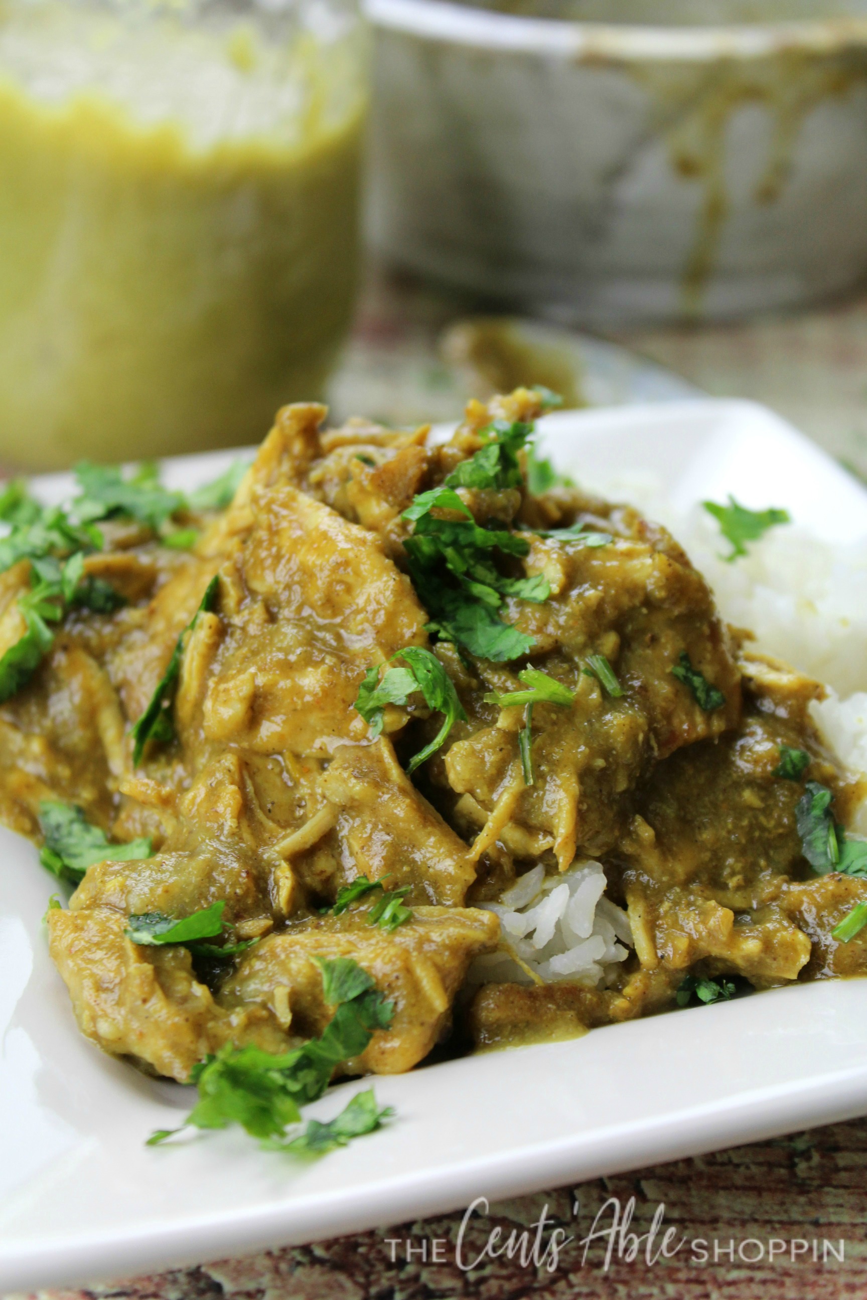 Shredded chicken cooked to perfection in a spicy Hatch green chile sauce and shredded to serve over rice - easily made in the Instant Pot! 