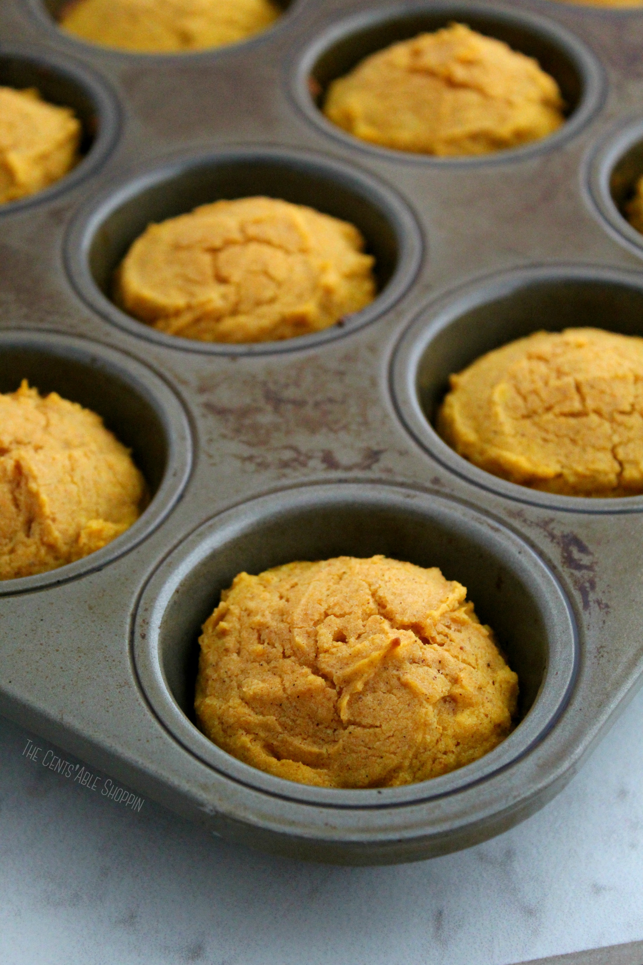 These Gluten Free Pumpkin Spice Muffins are soft, fluffy and sweet - made with the perfect amount of pumpkin spice. The perfect way to welcome fall!