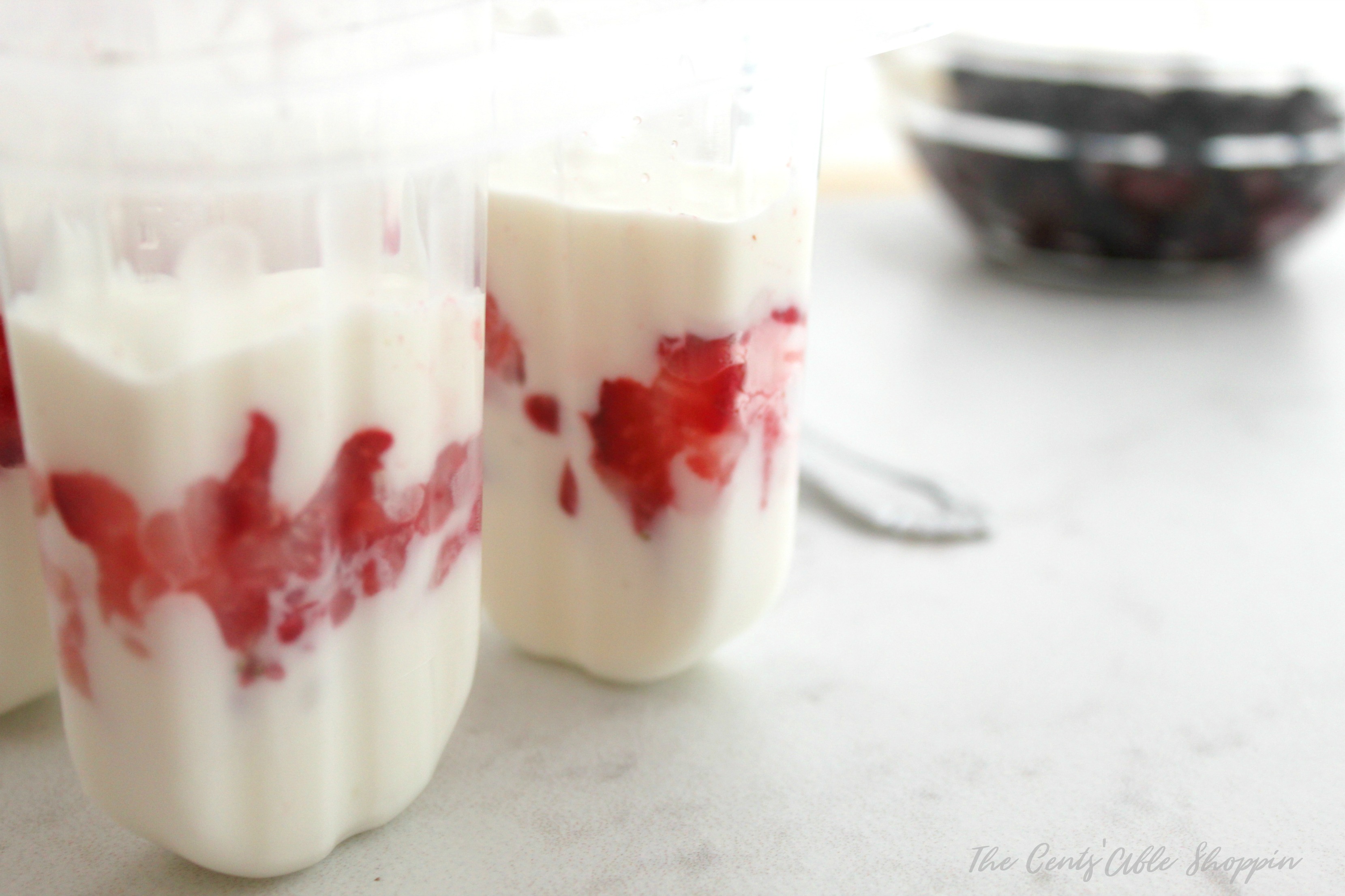 These delicious yogurt parfait breakfast popsicles make a great on the go breakfast for a busy morning - perfect for both kids and adults!