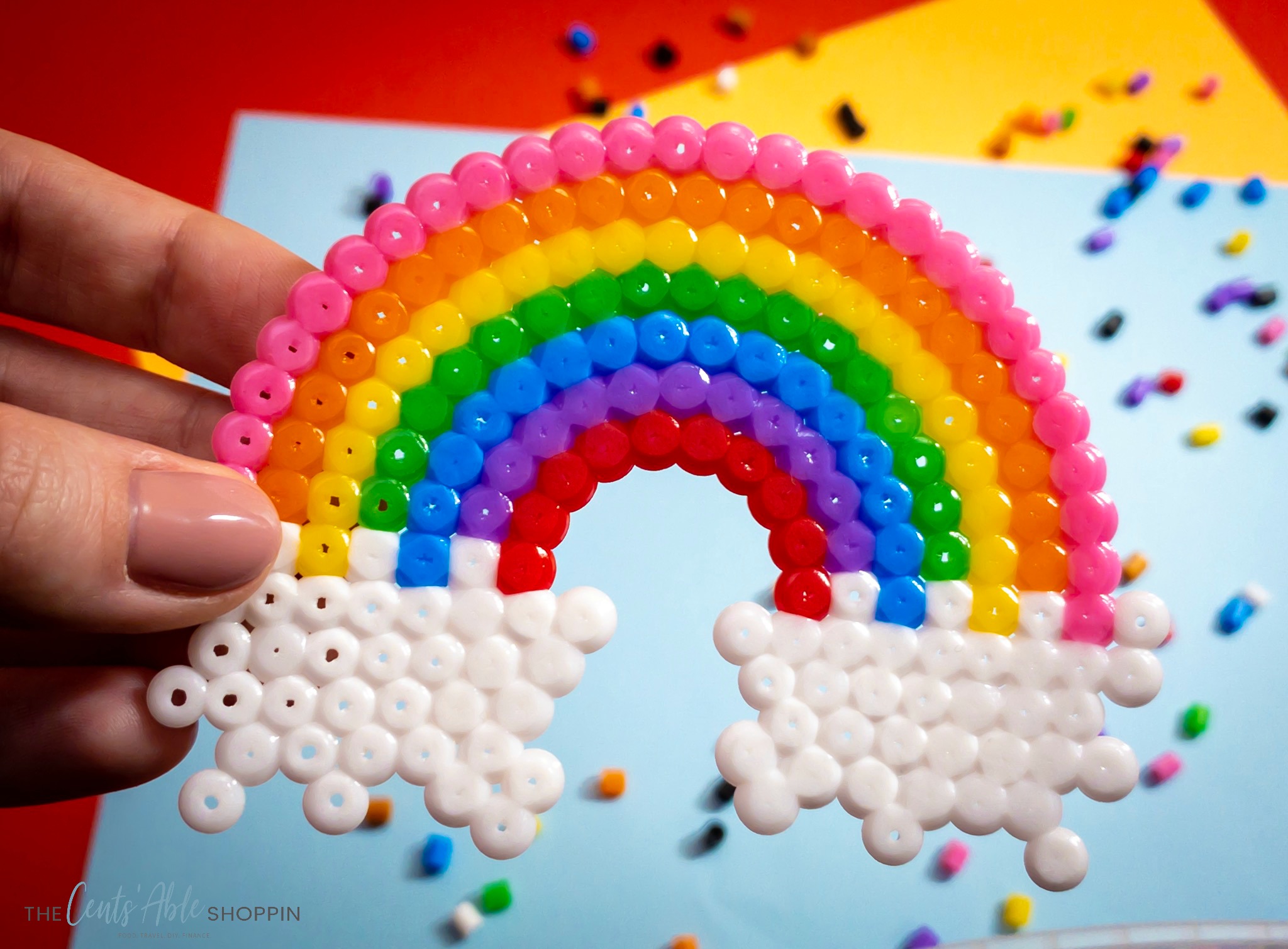 This perler bead rainbow will help kids develop fine motor skills, patience and artistic design while making a cute craft that's fun and colorful!