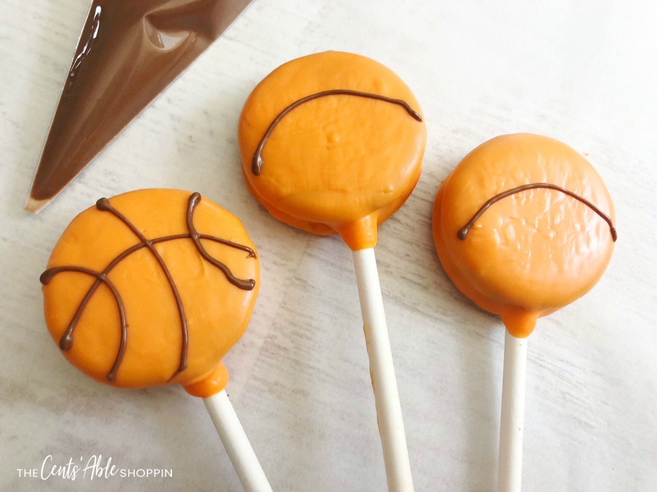 Yummy Basketball Oreo Pops - the perfect way to celebrate a successful season or a delicious treat to serve at game time!