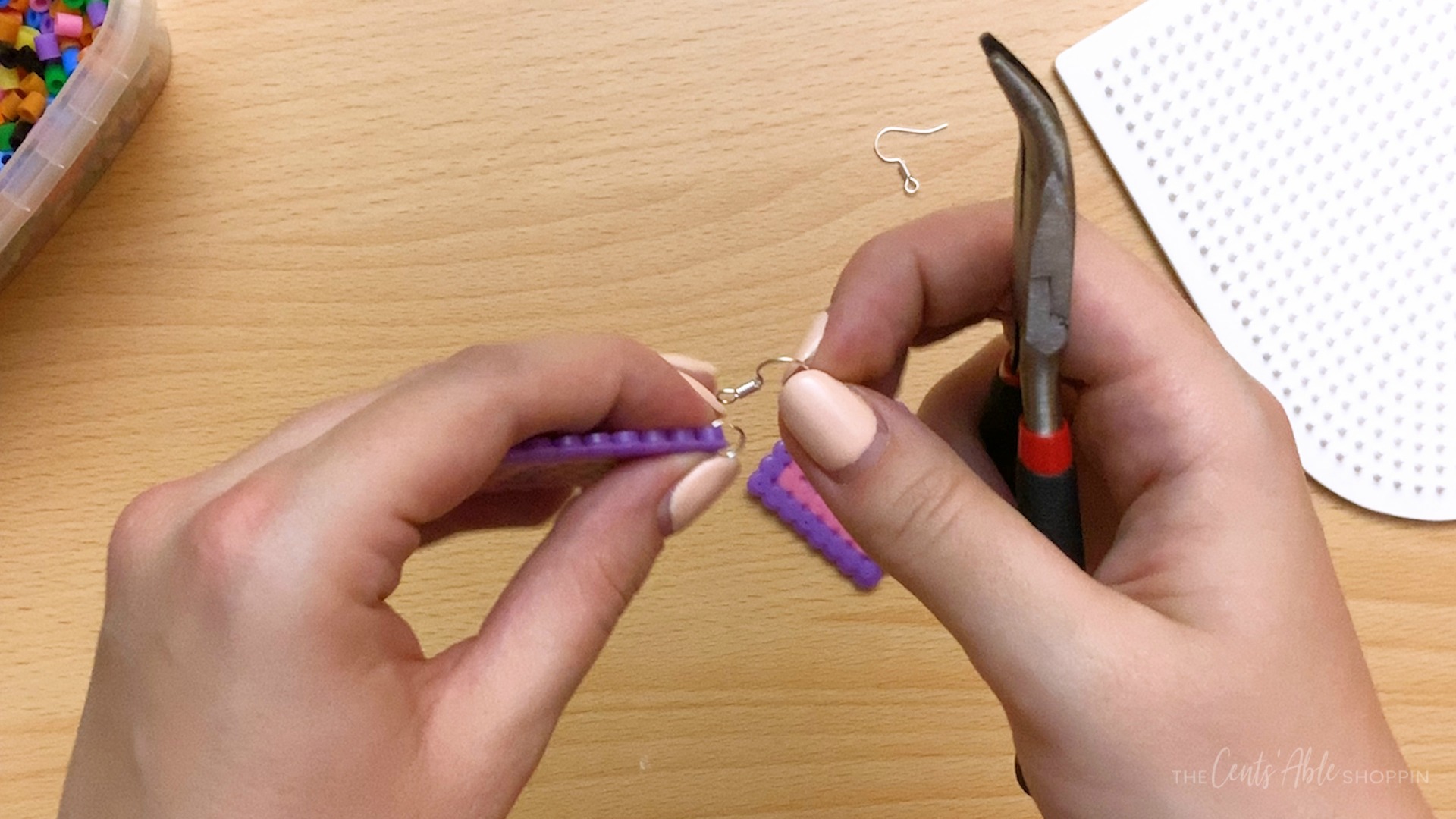 Attaching the earrings to the perler bead design