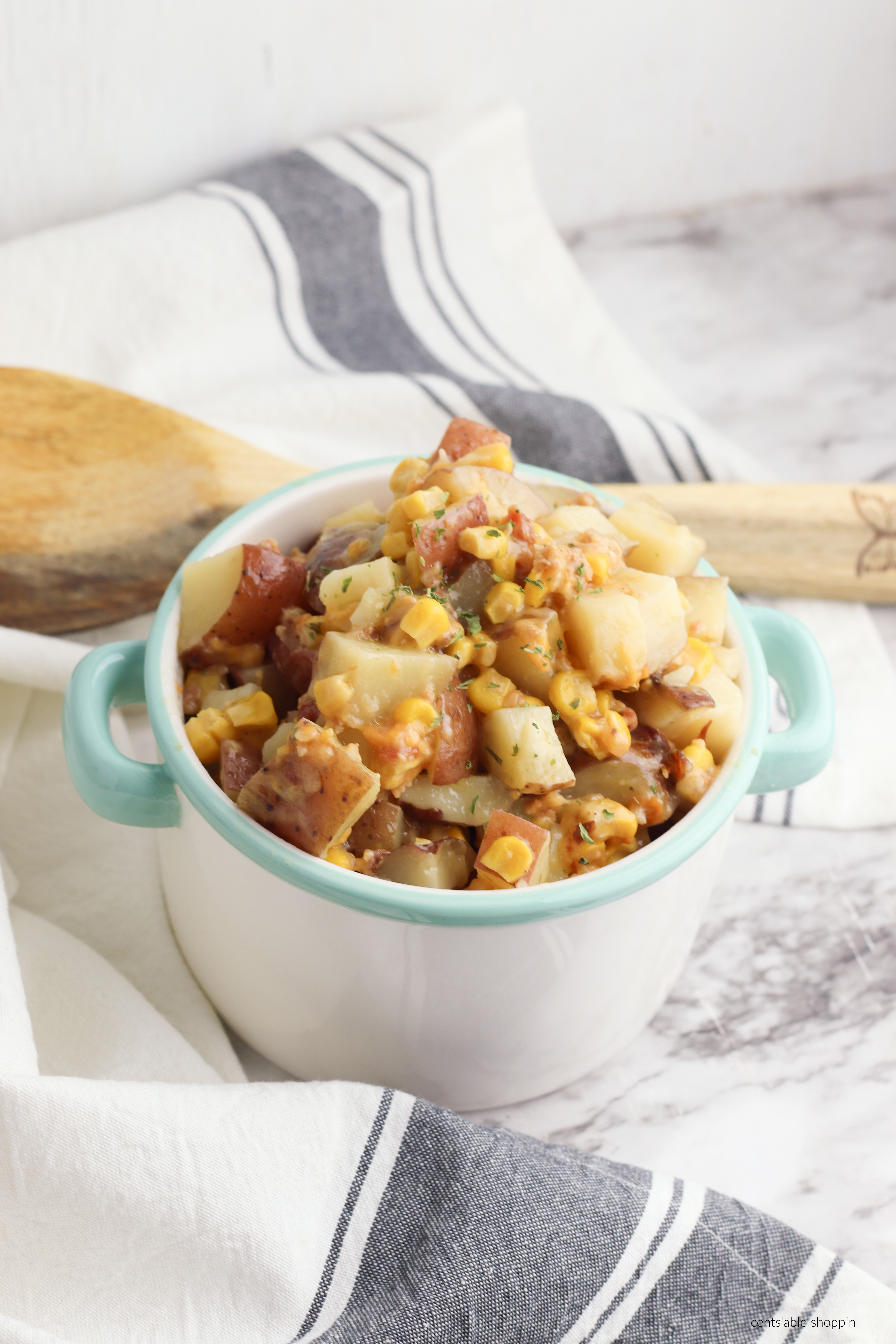 Super easy Slow Cooker Potatoes and Corn is the ultimate comfort food - easy to make and perfect dished up as a side to a larger meal!