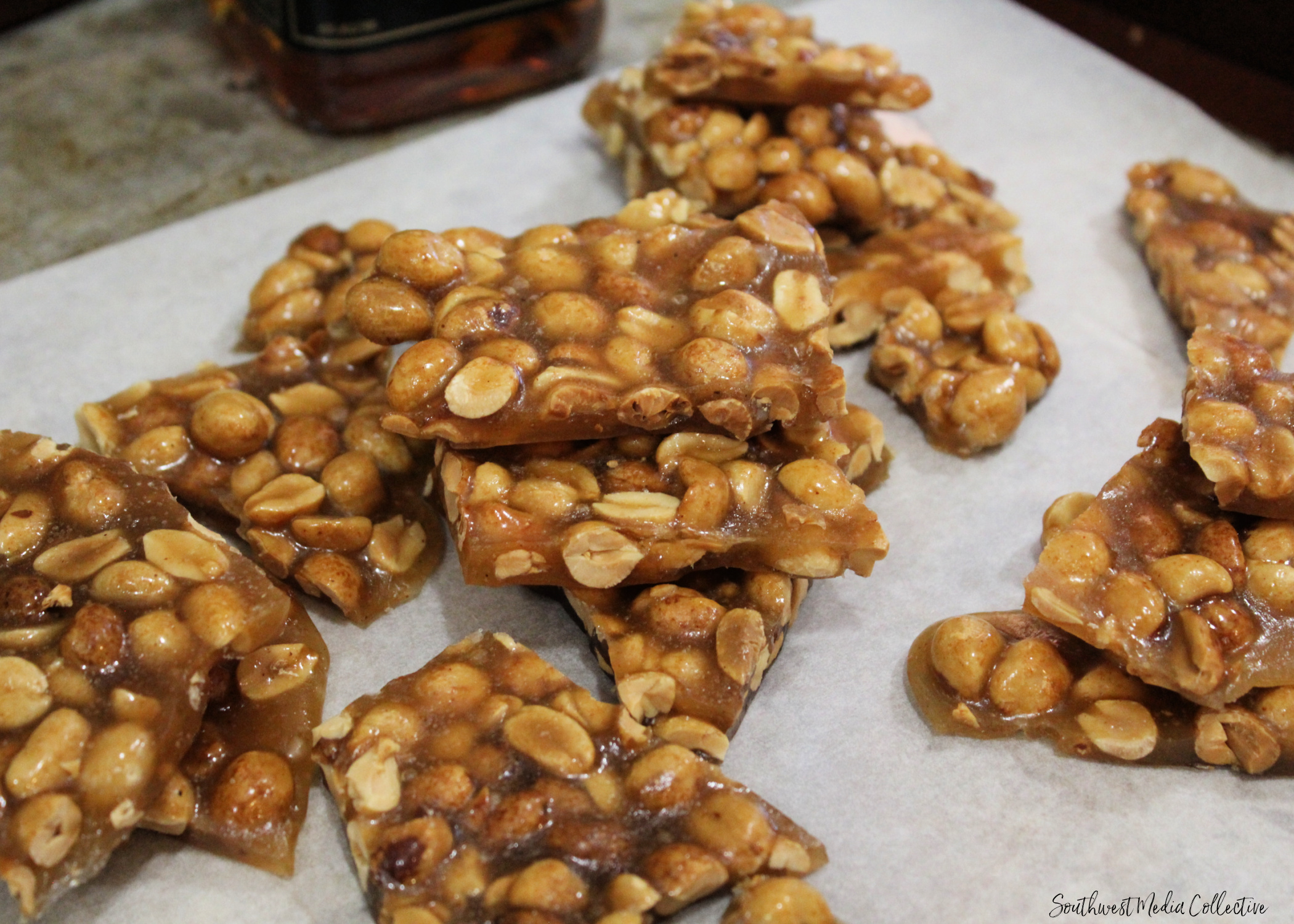 This Bourbon Peanut Brittle is a combination of salty and sweet and a perfect snack to make at the holidays for a party tray that's sure to please!