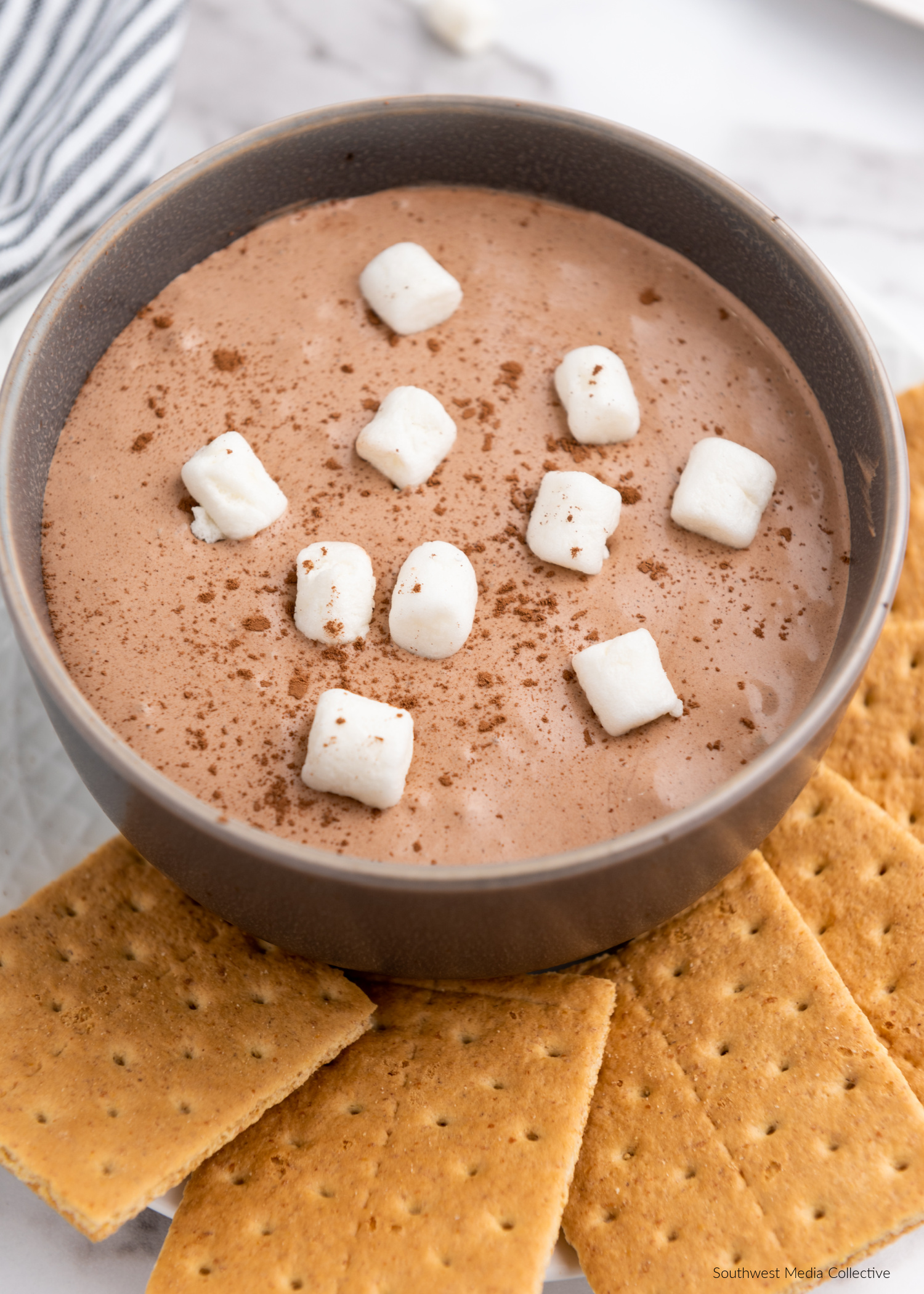 This easy Hot Cocoa Dip combines all of your favorite cozy hot cocoa flavors in a tasty dip that's super simple to throw together and delicious to eat!