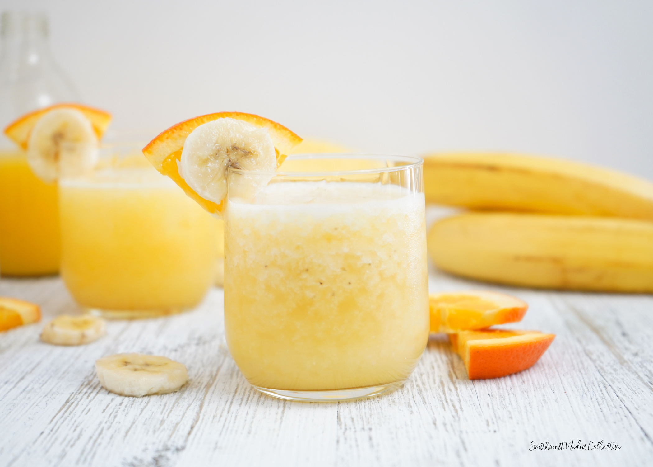 Tipsy Banana Cocktail made with 4 ingredients that come together with ice for a bright and cheery cocktail to bring on warmer weather!