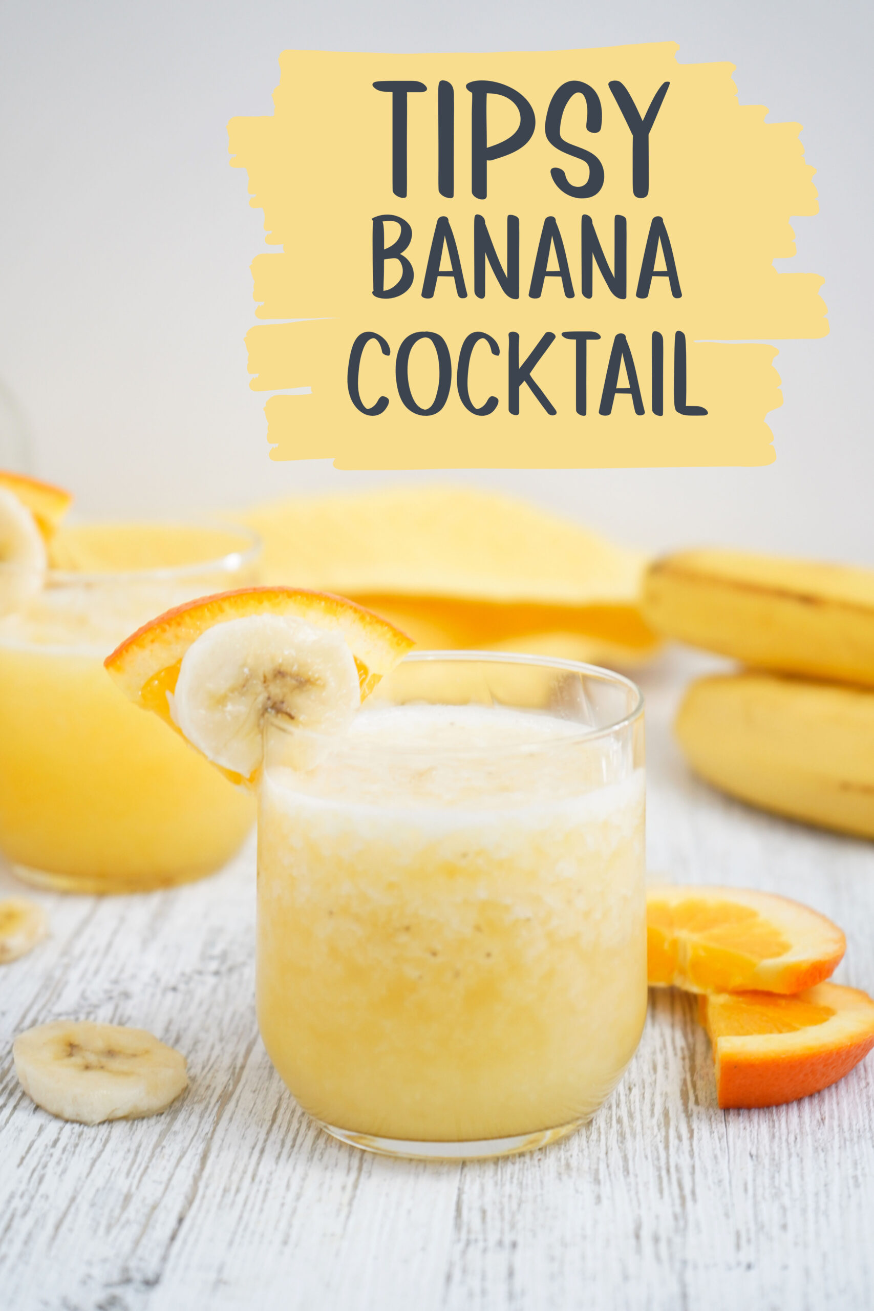 Tipsy Banana Cocktail made with 4 ingredients that come together with ice for a bright and cheery cocktail to bring on warmer weather!