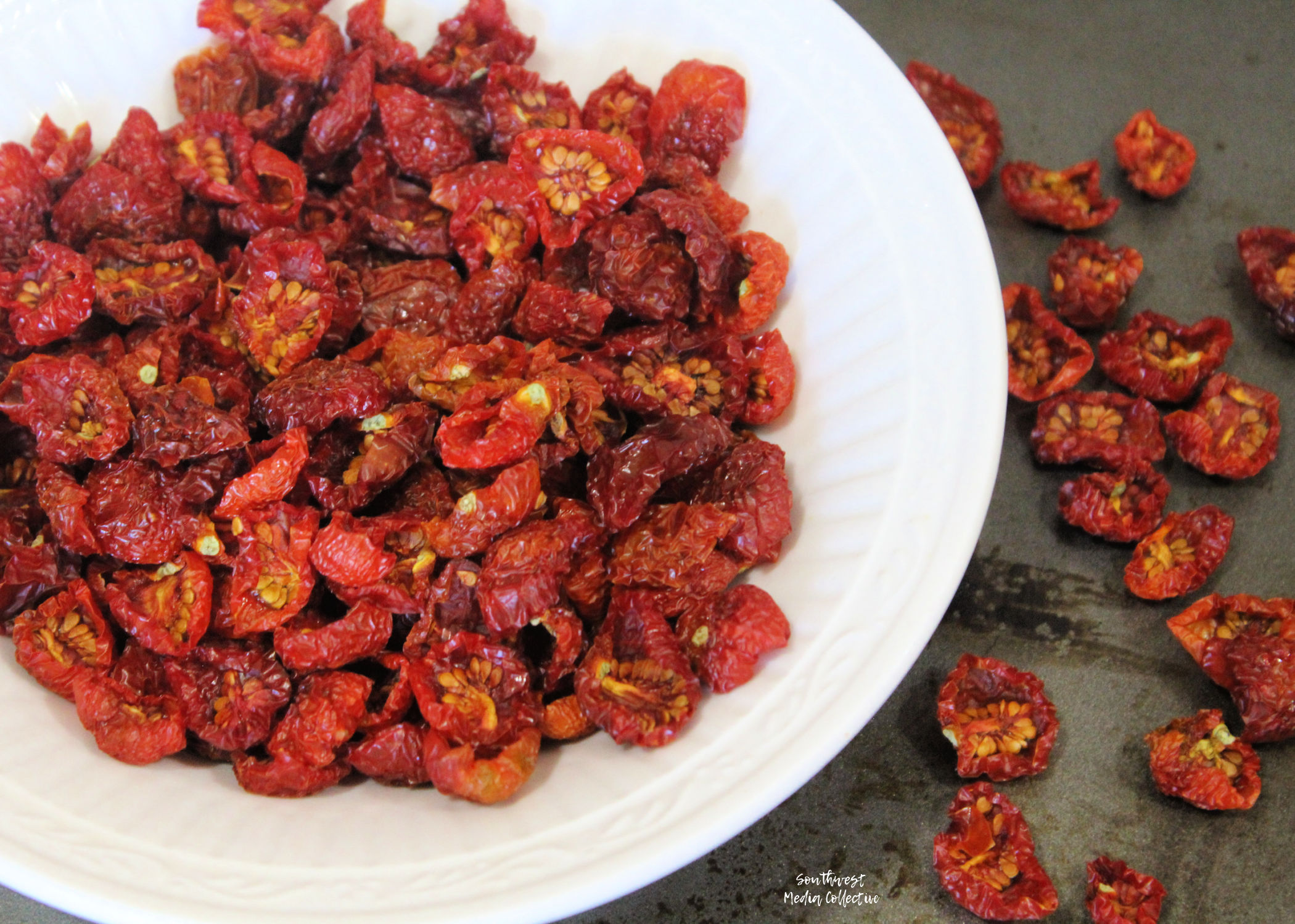 Step by step directions to help you dehydrate cherry tomatoes - the result is a tasty, burst of flavor that can be used in salads, wraps, bread and more!